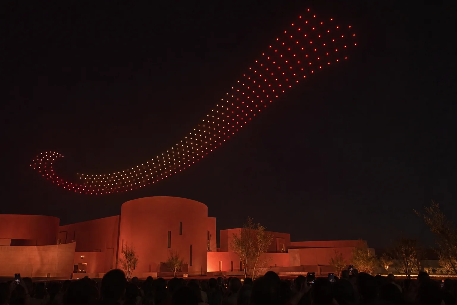 Creative drone formation flowing from a constellation into a luminous flower