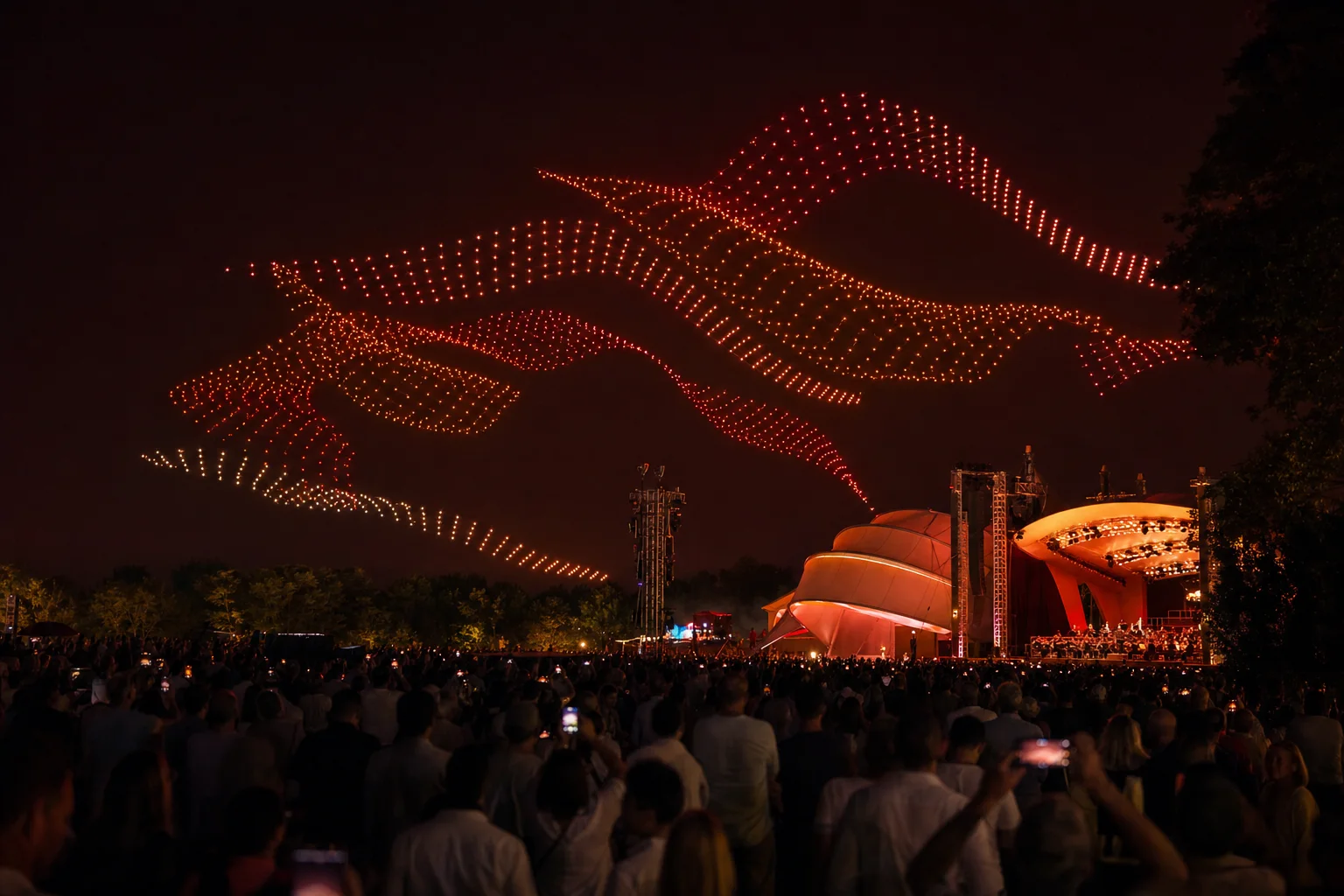 Layered drone formations above a waterfront festival