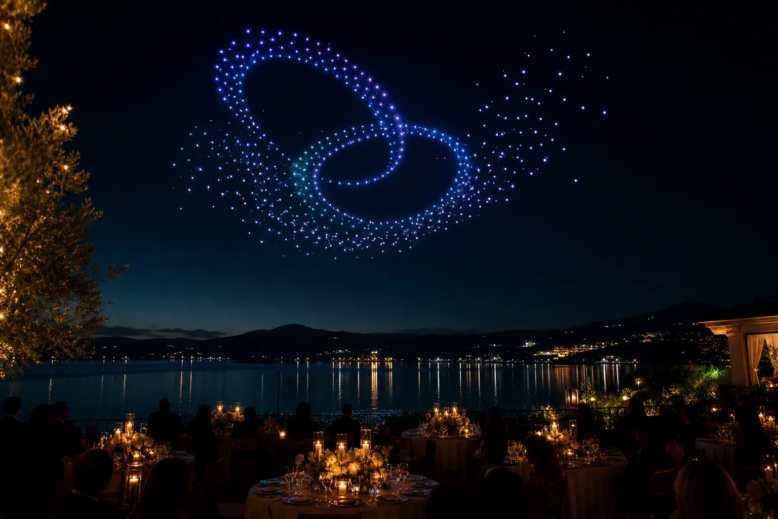 Interwoven celestial rings glowing above a lakeside wedding reception